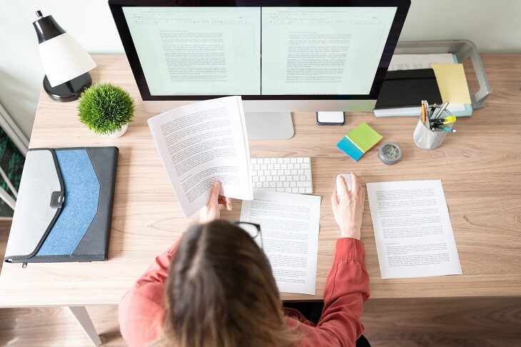 female employee using desktop computer