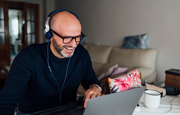 happy employee using a laptop