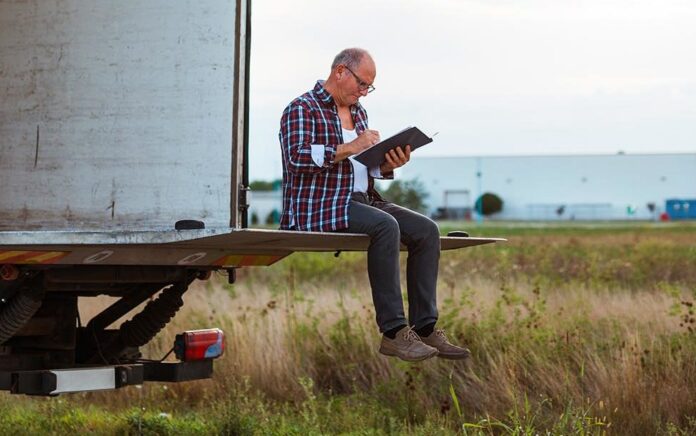 man sitting on the back of a van