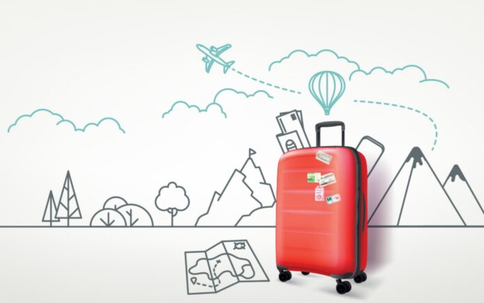 red suitcase and drawing of flight path