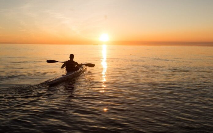 man with paddle