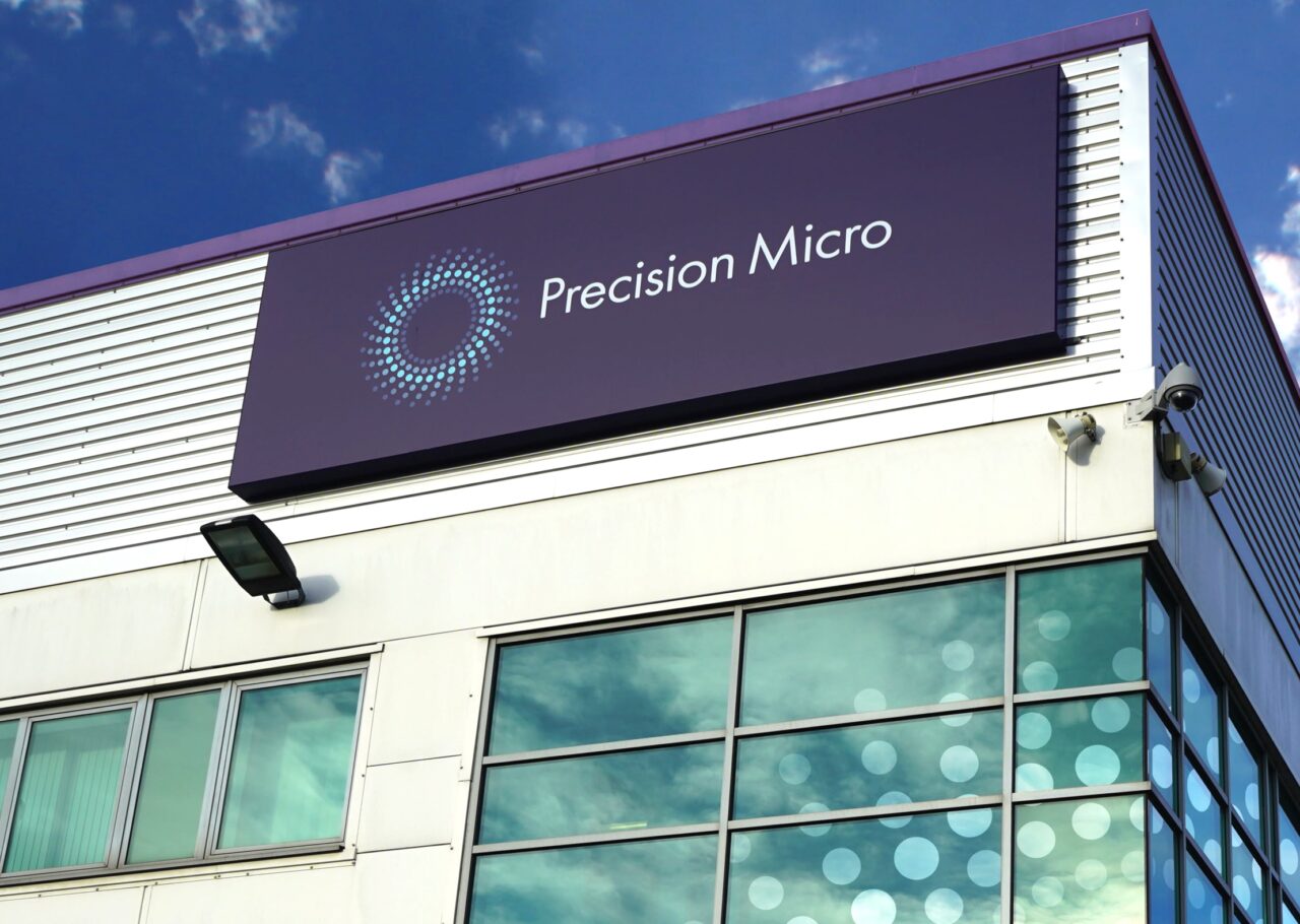 An exterior shot of the Precision Micro signing on their headquarters building