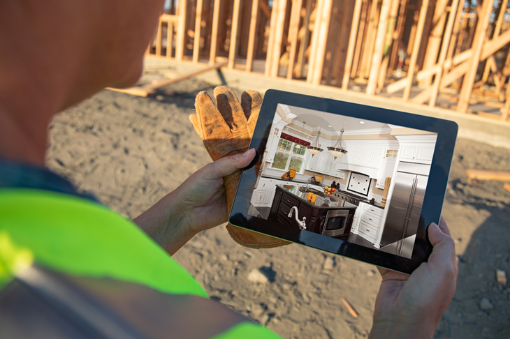 Construction worker holding iPad