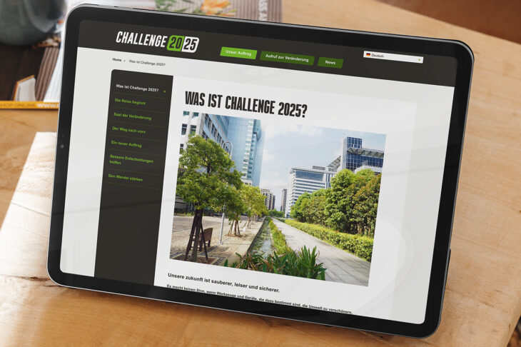 Challenge 2025 proposition translated to German shown on an electronic tablet screen that is resting on a coffee table