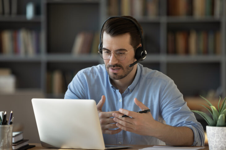 man wearing headphones on a video call
