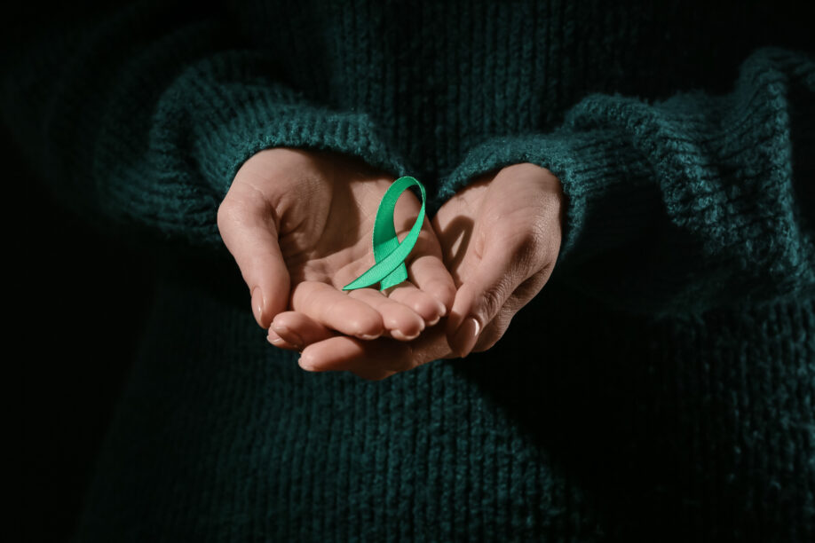Person holding mental health day ribbon