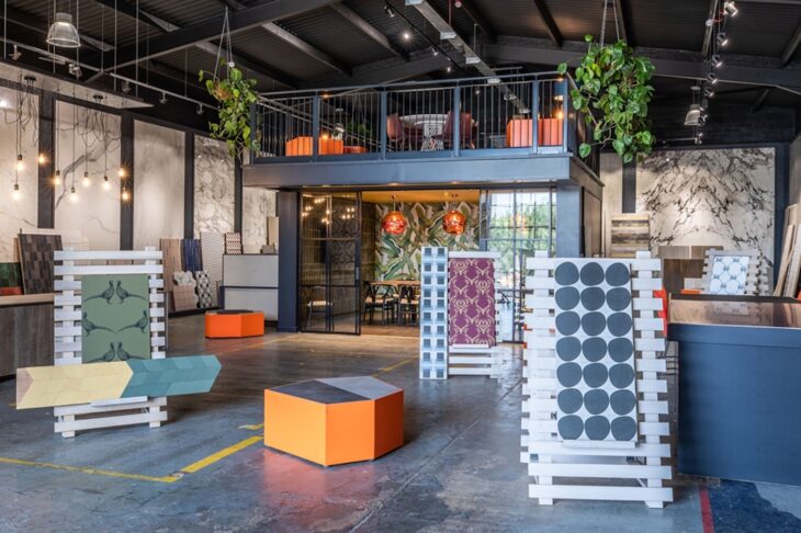 An interior shop floor location, in a factory with flooring examples on display.