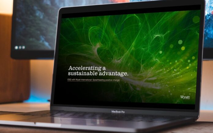 An image of a laptop with a display saying 'accelerating a sustainable advantage'.
