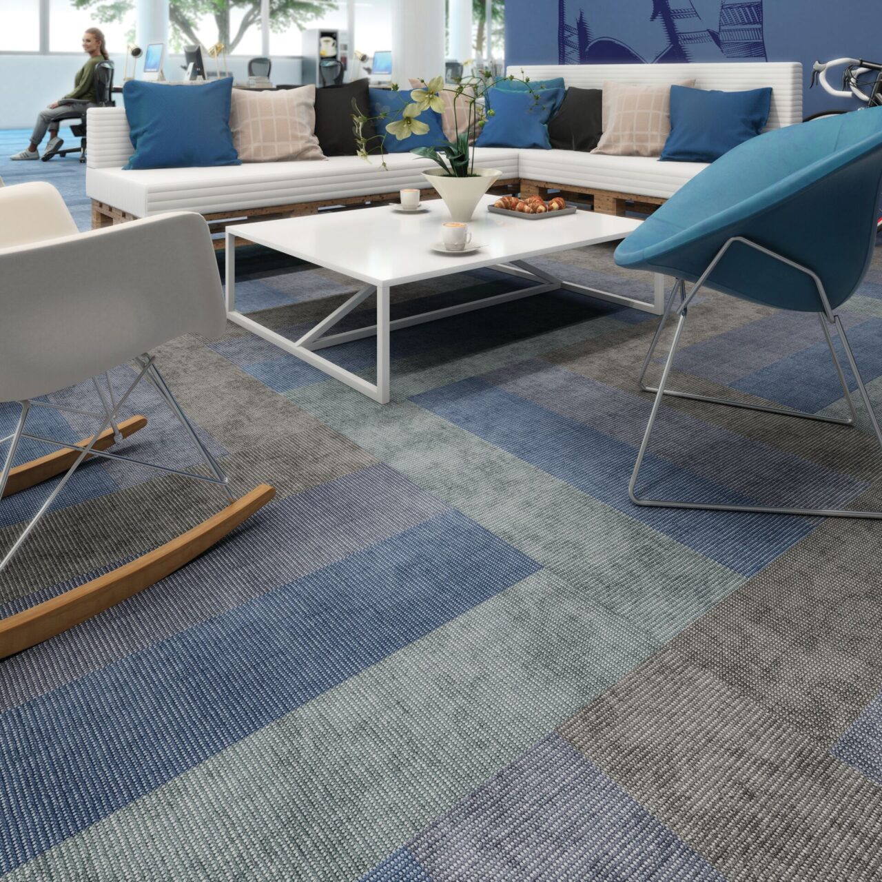 An interior shot of an office, featuring Forbo Medium Flotex Planks Ombre, sofas and chairs.