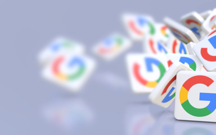 Google company logos fall on a table.