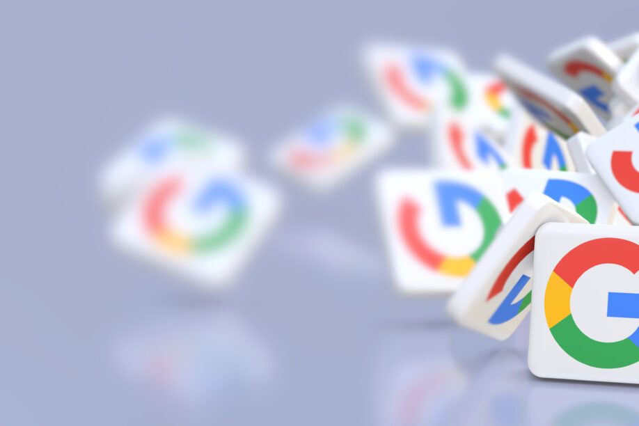 Google company logos fall on a table.