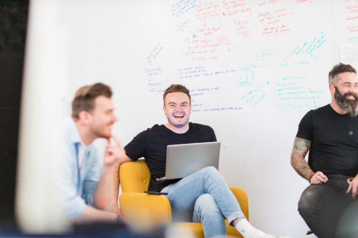 Image of Josh Handscomb, Account Director laughing with the team.