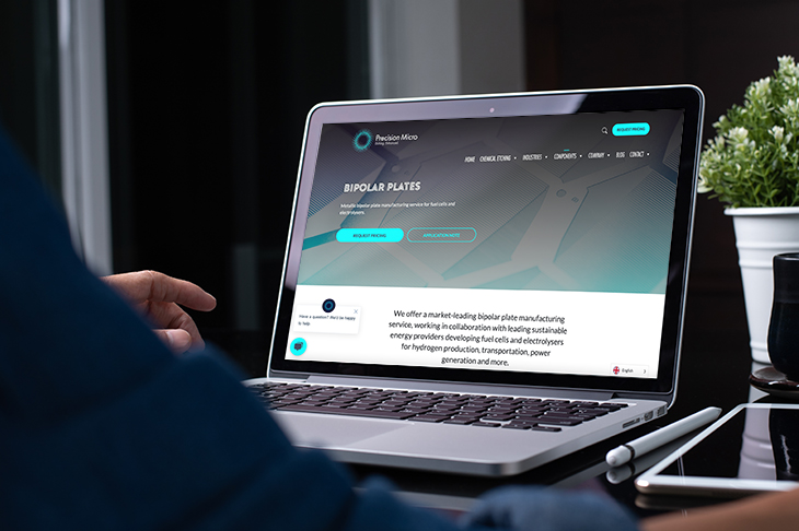 Precision Micro website on laptop