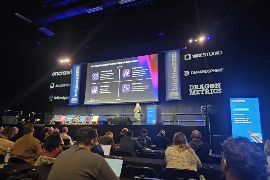 Conference talk at BrightonSEO with lots of people listening about psychology of marketing by Becky Simms