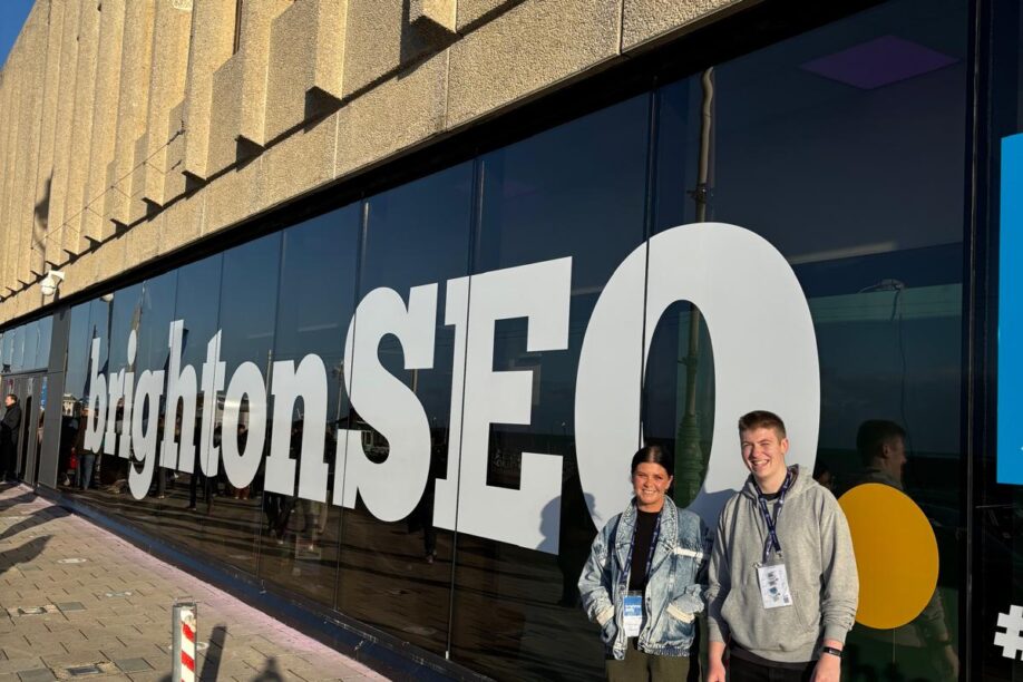 Two Wyatt International employees standing outside BrightonSEO entrance