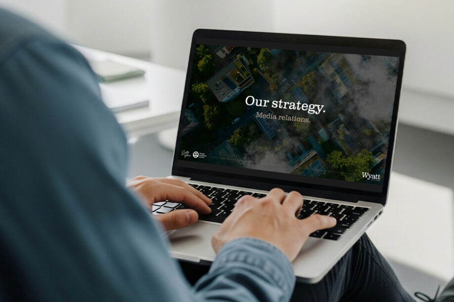 Man focused on a laptop displaying a strategic plan on the screen.