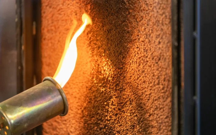 Torch on with lit fire against wall