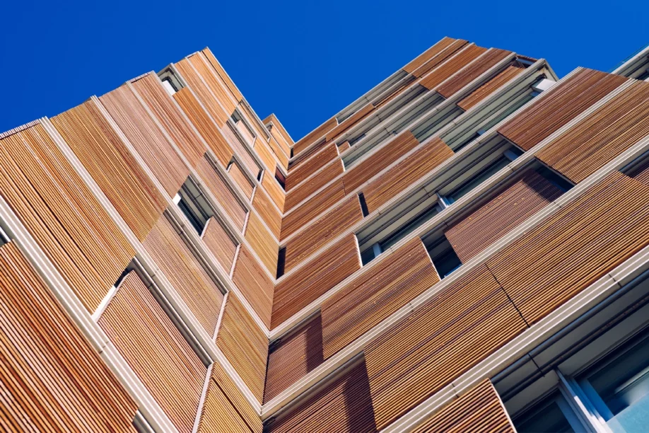 Building with wooden slats modern construction - built with net zero in mind